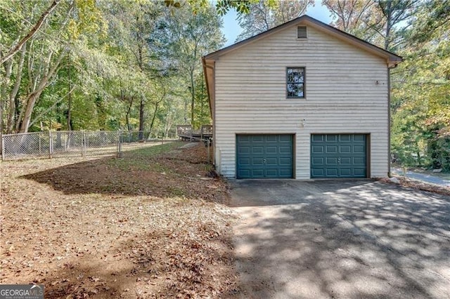 view of property exterior featuring a garage