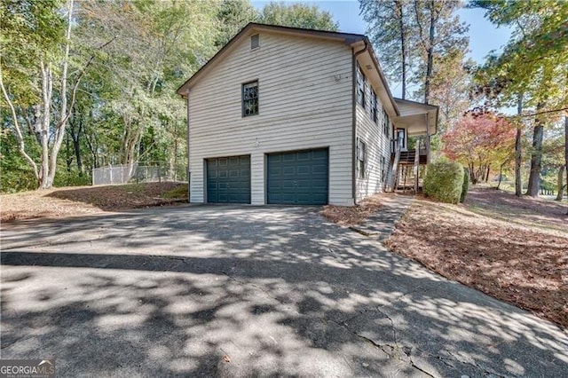 view of side of property featuring a garage