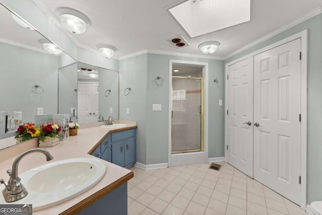 bathroom with walk in shower, a skylight, vanity, tile patterned floors, and ornamental molding