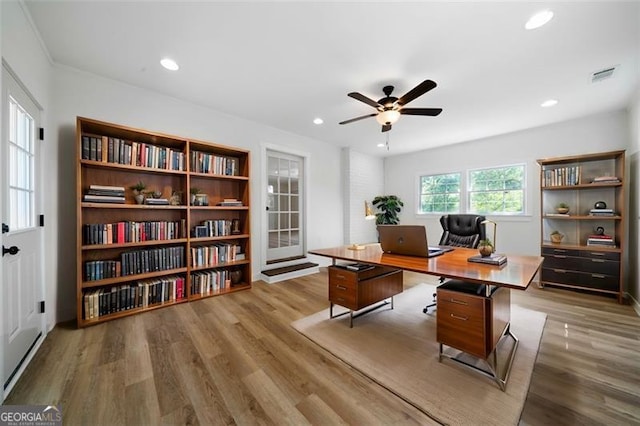 home office with ceiling fan and light wood-type flooring