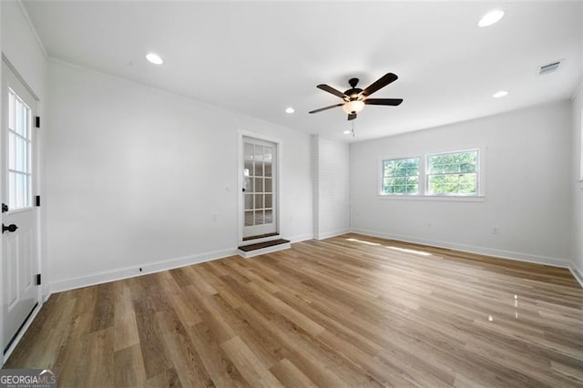 empty room featuring hardwood / wood-style floors and ceiling fan