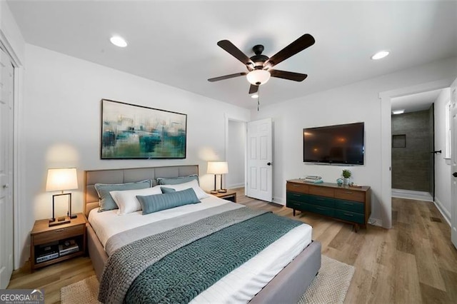 bedroom featuring ceiling fan and light hardwood / wood-style flooring