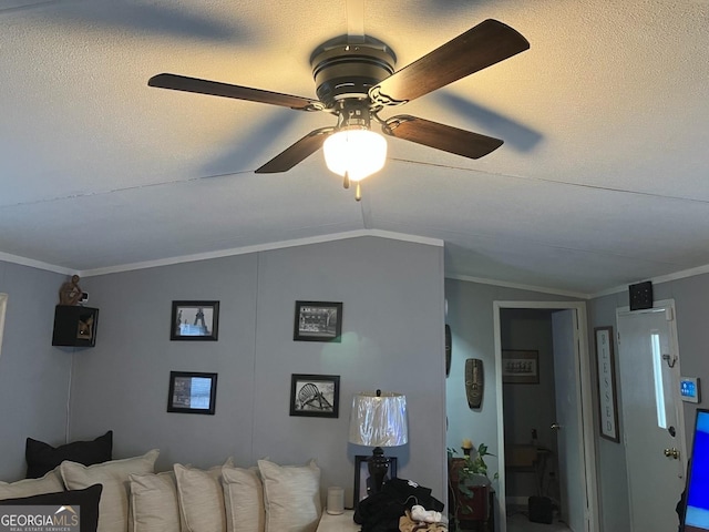 living room featuring vaulted ceiling, ceiling fan, and crown molding