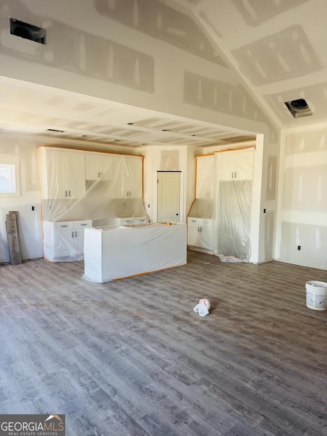 unfurnished living room featuring wood finished floors