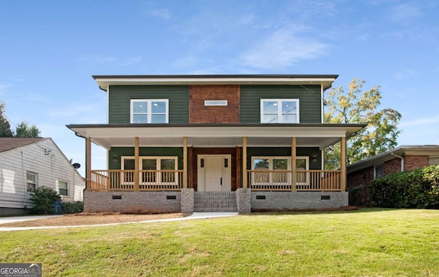 view of front facade featuring covered porch and a front lawn