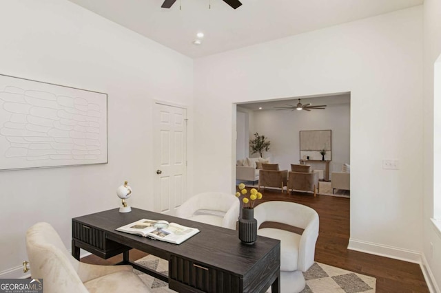 office area featuring dark wood-type flooring and ceiling fan