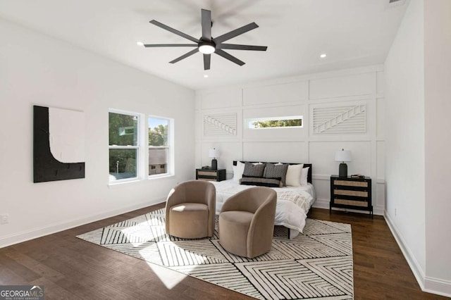 bedroom featuring ceiling fan and dark wood-type flooring