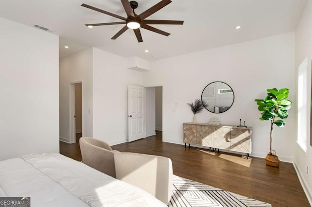 bedroom with ceiling fan and dark hardwood / wood-style floors