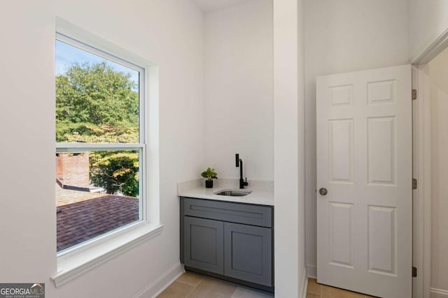 bathroom featuring vanity, tile patterned floors, and a wealth of natural light