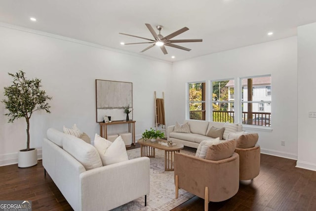 living room with ceiling fan, dark wood-type flooring, and crown molding