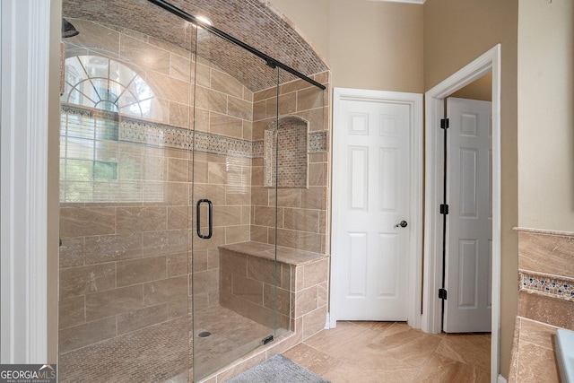 bathroom with an enclosed shower, brick ceiling, vaulted ceiling, and tile patterned floors