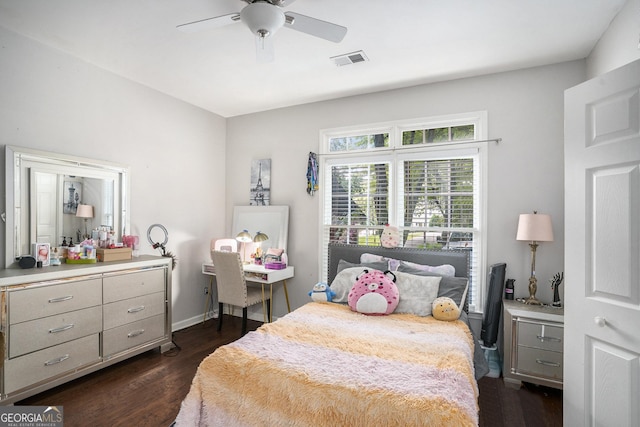 bedroom featuring ceiling fan and dark hardwood / wood-style floors