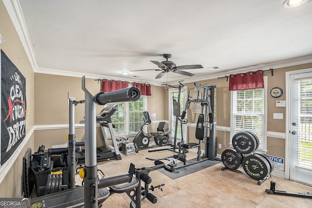 workout area with light tile patterned flooring, ceiling fan, and crown molding