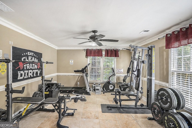 exercise room featuring light tile patterned floors, ceiling fan, and crown molding