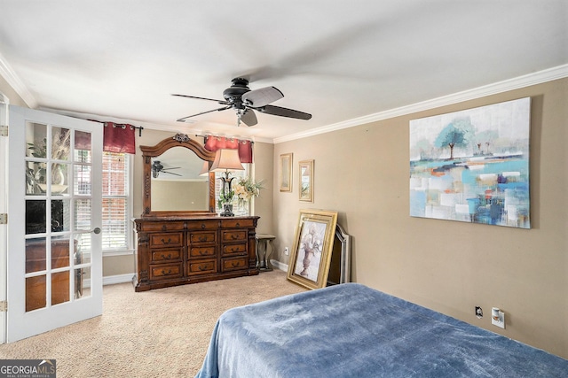 carpeted bedroom featuring ceiling fan and ornamental molding