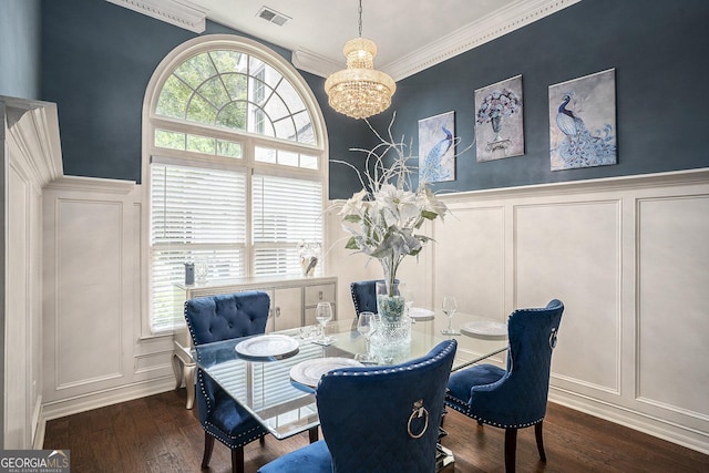 dining room with ornamental molding, dark hardwood / wood-style flooring, a wealth of natural light, and a chandelier