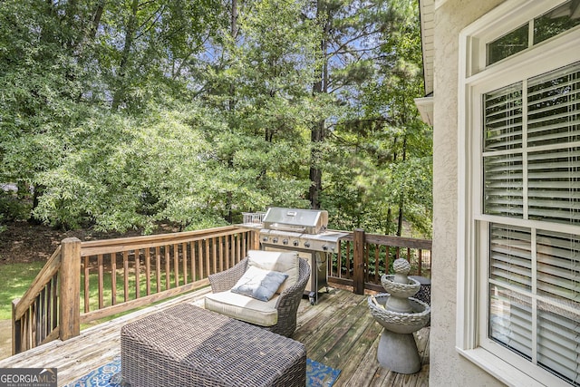 wooden terrace featuring grilling area