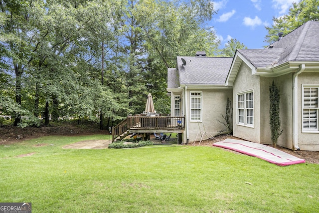 view of yard featuring a deck