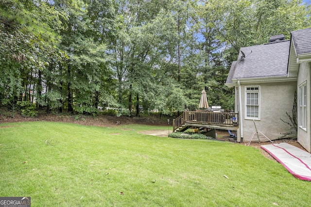 view of yard featuring a deck