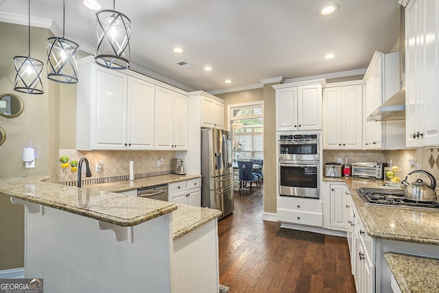 kitchen featuring stainless steel appliances and white cabinetry