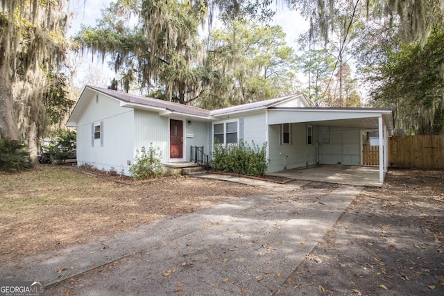 single story home featuring a carport