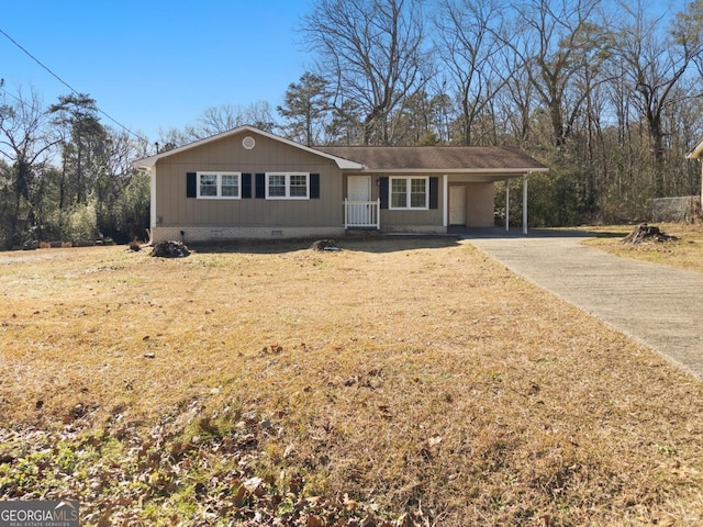 ranch-style home with a carport and a front lawn