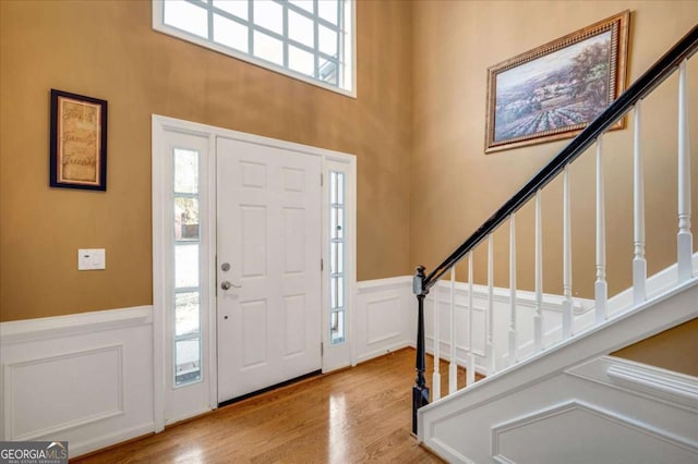 foyer entrance with light hardwood / wood-style flooring