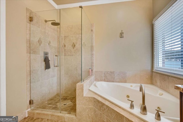 bathroom with independent shower and bath and crown molding