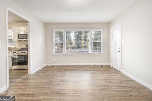 empty room with light wood-type flooring