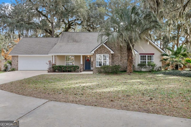 view of front of house featuring a front yard and a garage