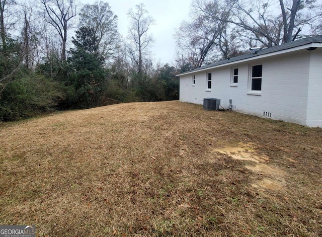 view of yard with central air condition unit