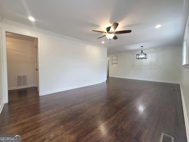 spare room with ceiling fan, dark hardwood / wood-style flooring, and ornamental molding