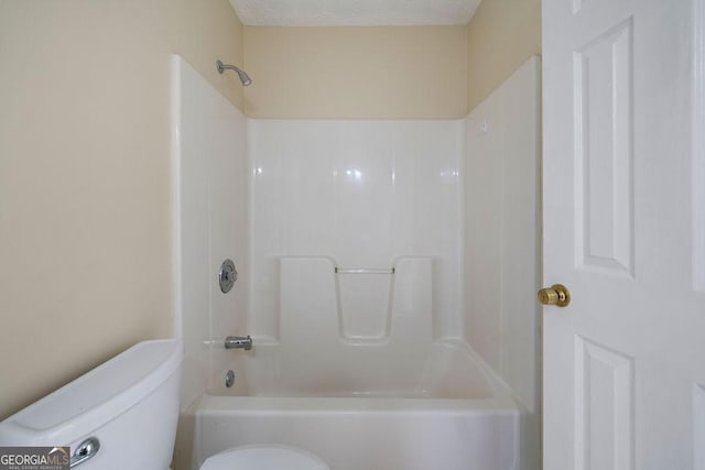 bathroom featuring toilet, a textured ceiling, and  shower combination