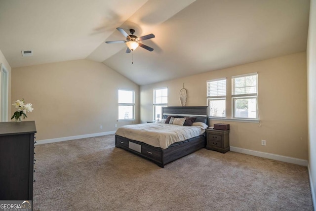 bedroom featuring ceiling fan, vaulted ceiling, and carpet flooring