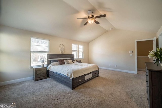 carpeted bedroom with ceiling fan and lofted ceiling