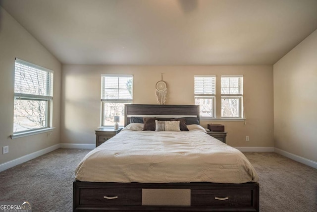 bedroom featuring lofted ceiling and light colored carpet