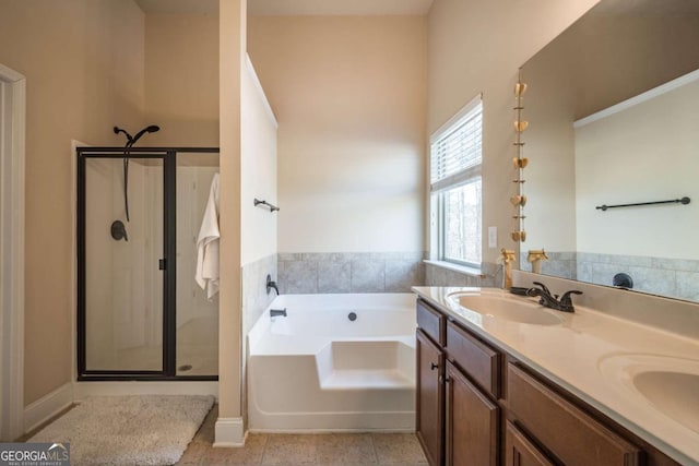 bathroom featuring tile patterned floors, vanity, and independent shower and bath