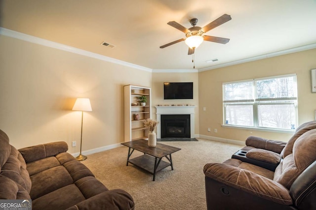 living room featuring ceiling fan, light colored carpet, and ornamental molding