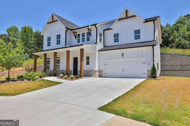 view of front of house with a porch and a garage