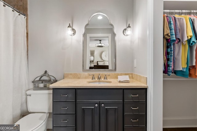 bathroom with toilet and vanity