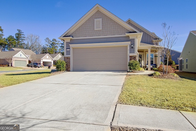 view of front of home with a garage and a front lawn