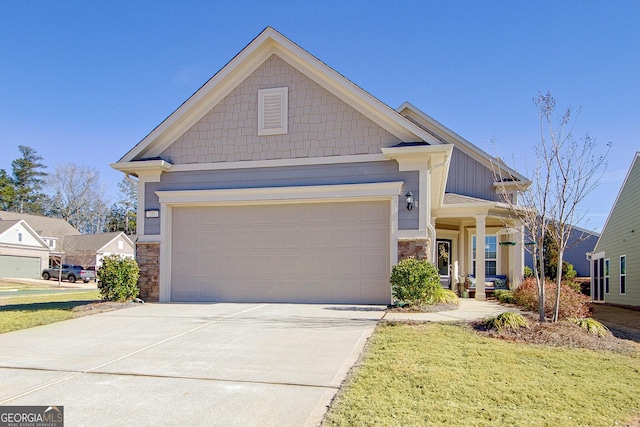 view of front facade featuring a garage and a front lawn