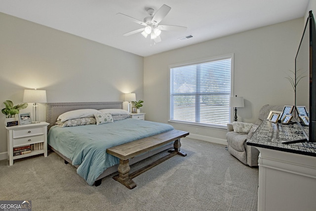 carpeted bedroom with ceiling fan