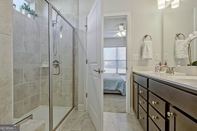 bathroom featuring an enclosed shower, ceiling fan, and vanity