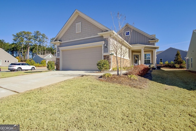 craftsman-style home featuring a garage and a front lawn