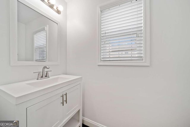 bathroom with a wealth of natural light and vanity