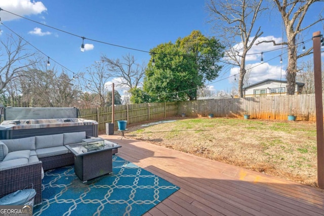 wooden deck featuring a lawn, a hot tub, and outdoor lounge area