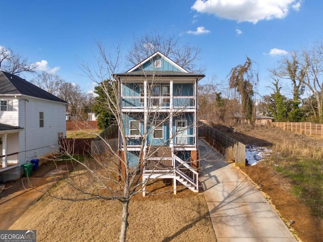 view of front of house featuring a balcony