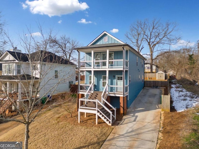 view of front of property featuring covered porch and a balcony