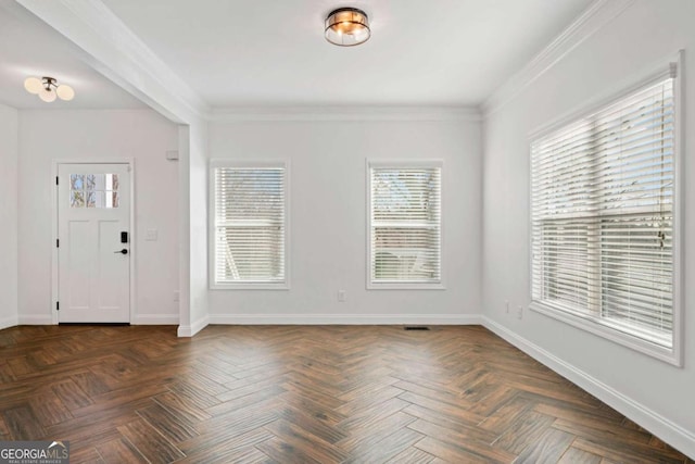 foyer entrance with dark parquet flooring and crown molding